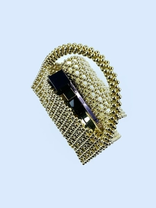 Handmade gold beaded triangle hollow shoulder bag featuring woven metallic beads for women