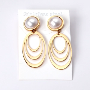 Gold layered geometric stainless steel earrings with white pearls and concentric metal rings