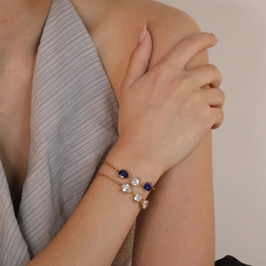 Luxurious 18K gold plated layered bracelets with blue and white teardrop crystals