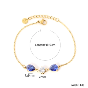 Macro view of 18K gold bracelet with 7x9mm water-drop blue gems and clear zircon details