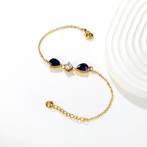Luxury 18k gold plated stainless steel bracelet with blue pear-cut and round crystals