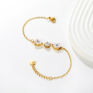 Elegant 18k gold plated stainless steel bracelet with three pear-shaped zircon stones
