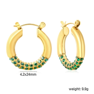 Detail of 24mm gold earrings with green pavé crystals and 4.2mm band thickness