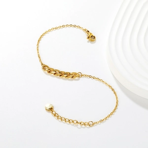 Minimalist 18K gold chain bracelet featuring a polished Cuban link segment and S-curve design