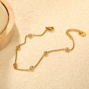 Gold stainless steel bracelet with six round crystals on minimalist chain link