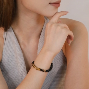 Natural tiger eye and matte black bead bracelet with gold accents for men and women