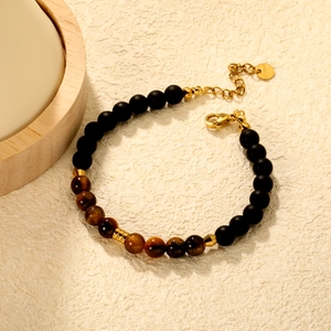 Tiger eye and matte black beaded bracelet with gold stainless steel charms for women
