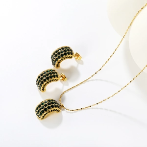 Elegant gold jewelry set with C-shape emerald green crystal necklace and stud earrings