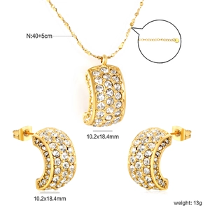 Fashion C-shape jewelry set with emerald green stones and pavé crystals on gold finish