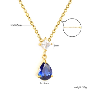 Detail of 45cm gold chain necklace with square zircon and pear-cut blue gemstone