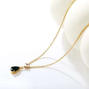 Gold vintage necklace featuring teardrop dark green stone and square zircon pendant