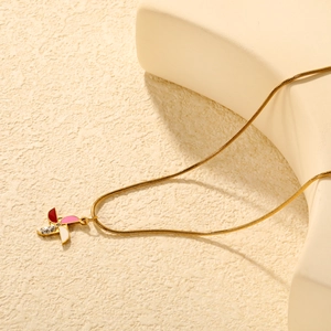 Collana a catena serpente dorata con ciondolo a mulino a vento smaltato e piccoli diamanti
