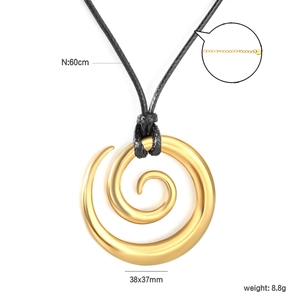 Close-up of golden hollow spiral pendant with size measurements and cord necklace