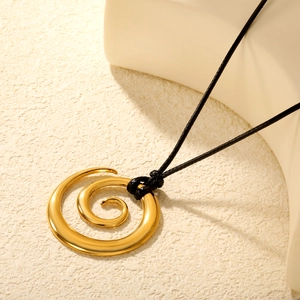 Minimalist gold spiral pendant necklace on black wax rope cord with a polished metal finish