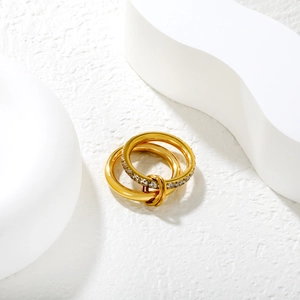 Detail of linked 18k gold stainless steel rings with sparkling zircon micro-pave setting