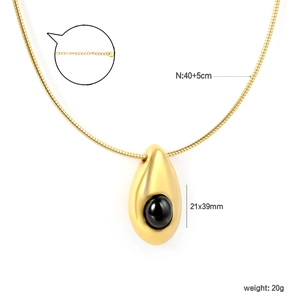 Detail view of gold snake chain with black onyx teardrop pendant and S925 engraving