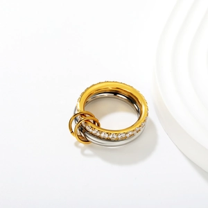 Detail of two-tone gold and silver linked rings with sparkling zircon pavé setting