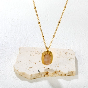 Minimalist 18K gold satellite chain with pink oval stone pendant on stone base