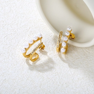 Elegant gold-plated stainless steel earrings featuring white pearls and zircon accents