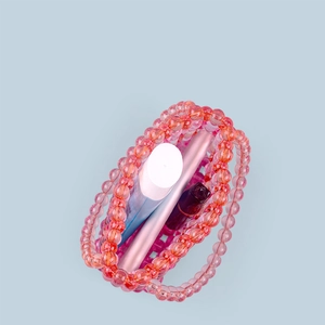 Close-up of pink acrylic beaded handbag showing internal storage for cosmetics