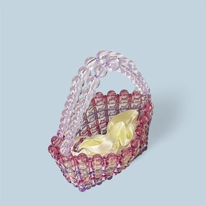 Close-up of rainbow beaded handbag with purple acrylic beads and yellow satin inner pouch
