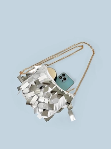 Silver sequin tassel crossbody bag with gold chain strap and spacious interior