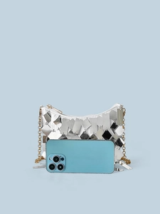 Silver sequin shoulder bag with chain strap and phone for size comparison