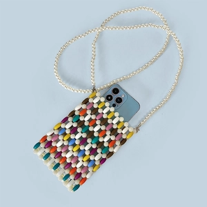 Detail showing the spacious interior of a colorful beaded phone bag with pearl strap