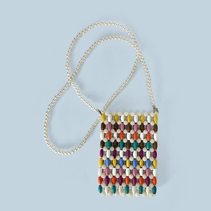 Close-up of handmade colorful wooden bead crossbody bag with pearl strap detail
