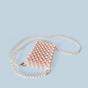 Detail of pink and white handmade beaded mini bag with elegant pearl shoulder strap