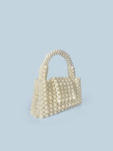 Handcrafted white pearl beaded handbag with elegant spherical texture for wedding parties