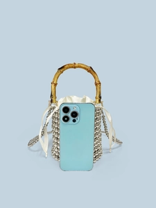 Mini silver beaded bucket bag with bamboo handle and drawstring insert for crossbody use