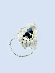 Elegant white pearl beaded bucket bag with satin drawstring liner and long strap