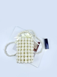 Handcrafted pearl bucket bag with woven beads and satin drawstring lining for evening wear
