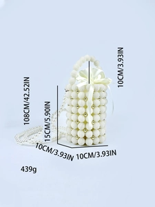 Detail of woven pearl evening bag with drawstring satin lining and gold accents