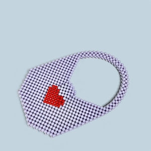 Detail of lavender acrylic beaded handbag with red heart pattern and integrated handle