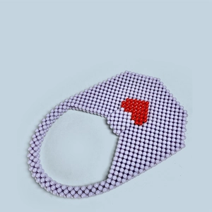 Detail of handmade beaded tote bag with a red heart pattern on purple acrylic beads
