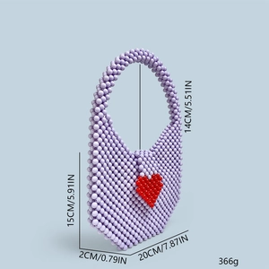 Detailed view of handmade beaded lavender handbag with red heart pattern and dimensions