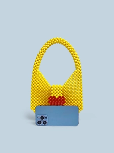 Handmade yellow acrylic beaded shoulder bag with red heart pattern and top handle