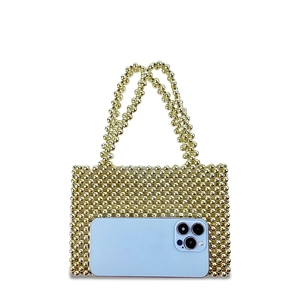 Close-up of a handmade golden metallic beaded mini tote bag with dual handles