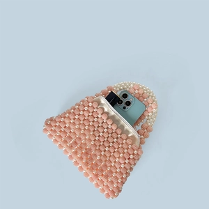 Pink and white beaded handbag interior capacity with smartphone and lipstick