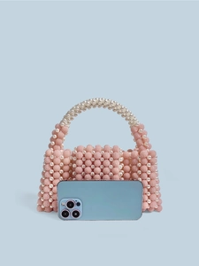 Pink and white handmade pearl beaded handbag with flap and pearl top handle