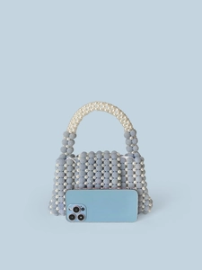 Handmade beaded handbag in light blue and white pearls with a stylish integrated handle