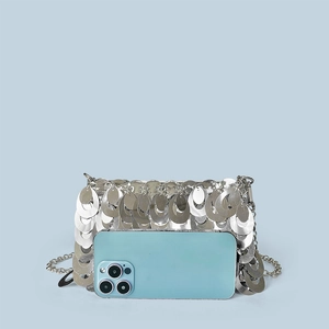 Close-up of silver sequin chain bag with metallic fish scale texture and shiny finish