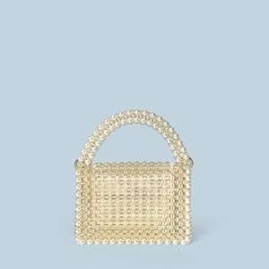 Close-up of handmade beaded handbag showing intricate geometric pearl pattern weaving