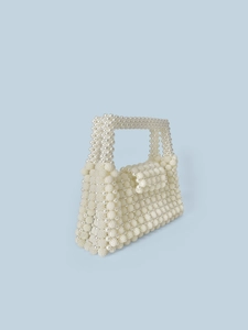 Elegant white handmade pearl beaded handbag with woven texture and top handle for women