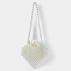 Detail of heart-shaped pearl beaded handbag with satin drawstring lining and shoulder strap