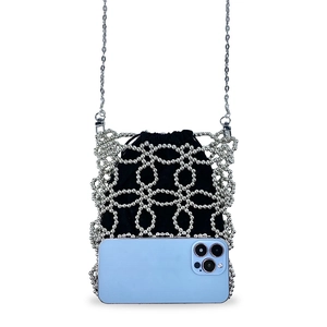 Close-up of handmade silver beaded crossbody mini bag with black drawstring lining