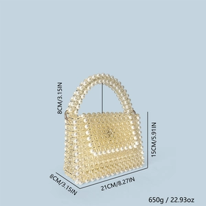 Detail view showing dimensions of a handmade beaded handbag with pearl top handle