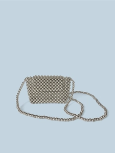 Close-up of the intricate handmade silver bead weave and metallic chain strap detail